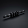Handheld Muscle Roller Stick on onyx background