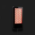 Red Light Therapy Device on onyx background